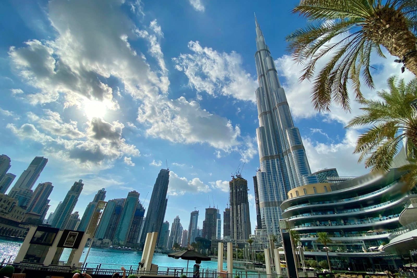 The Dubai skyline with the Burj Khalifa under a bright sky
