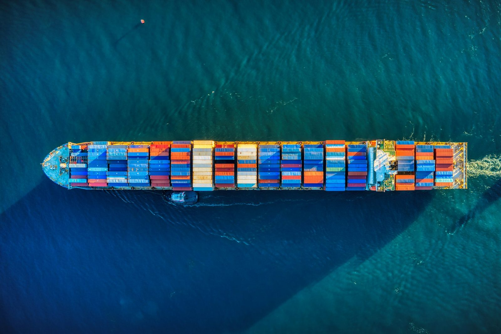 An aerial view of a container ship under way on open water